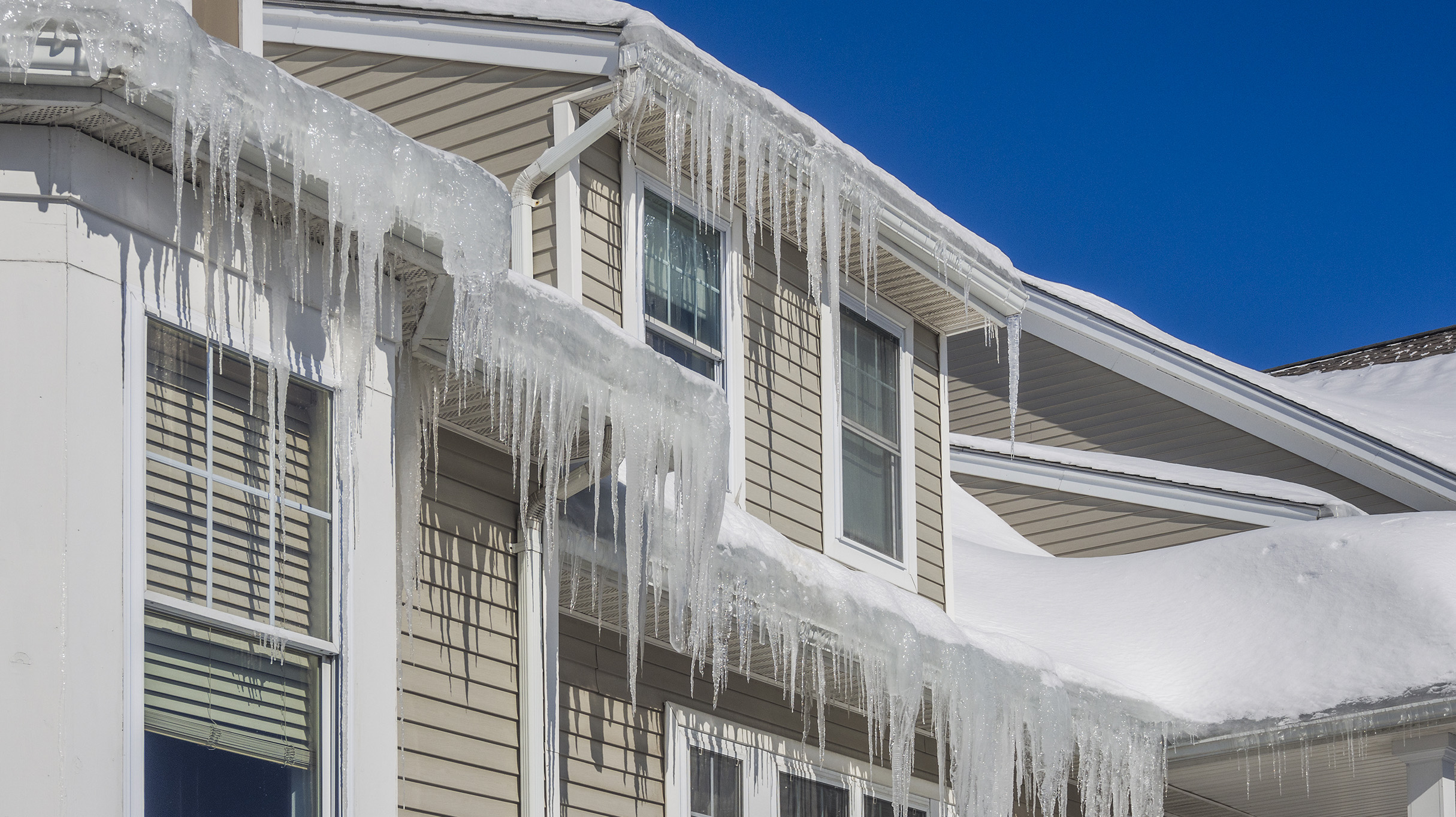 Ice dams and snow on roof and gutters